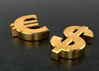 Two large, gold 3D symbols for the euro (€) and the US dollar ($) lie on a dark, textured surface, positioned side by side. | GoldZeus.com